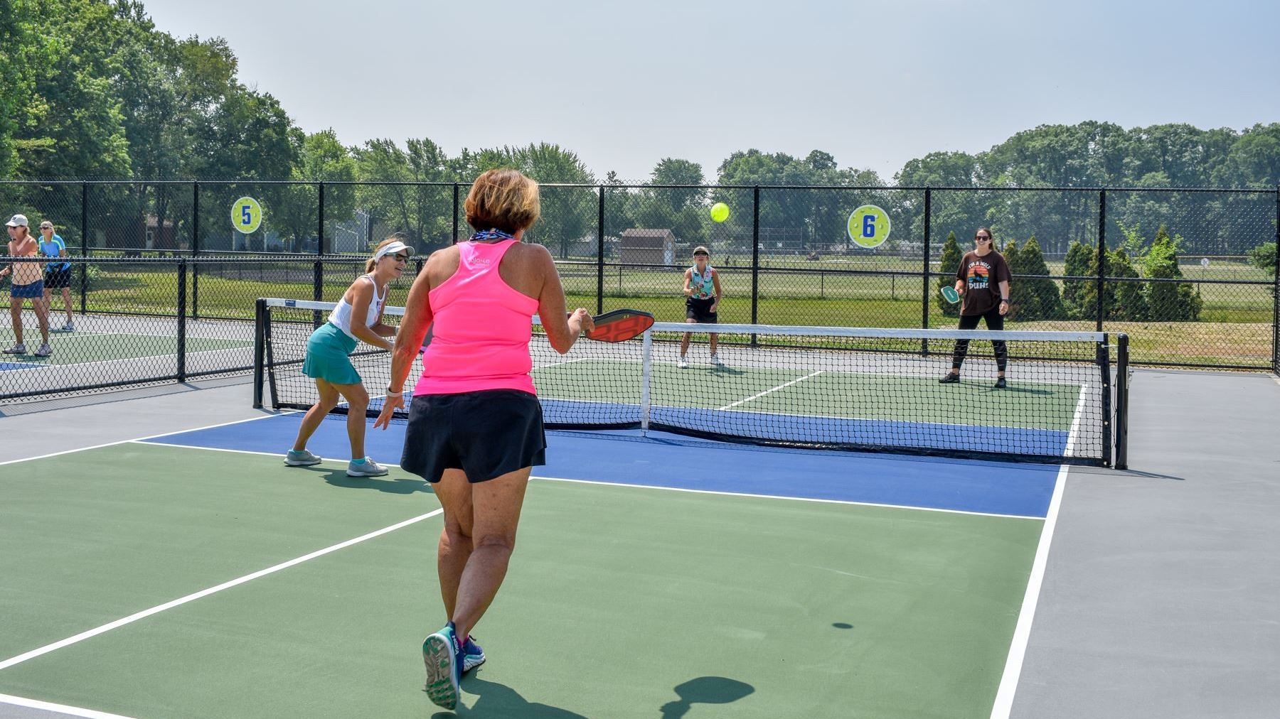 Woman Serving Pickleball