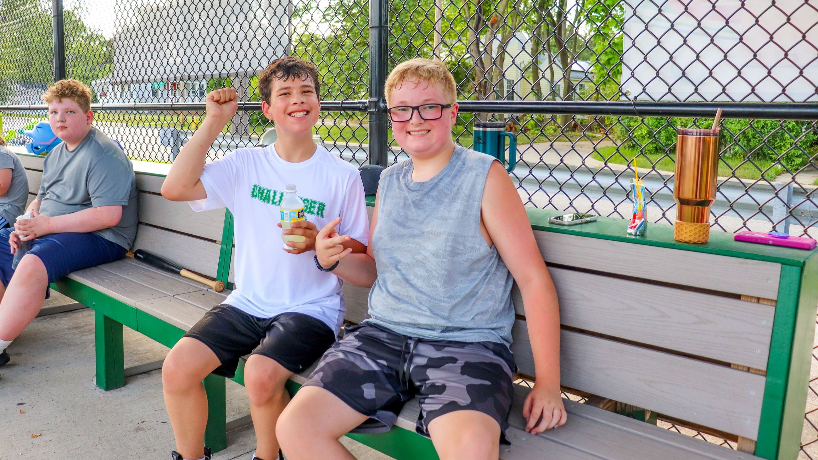 Two players smiling in a dugout